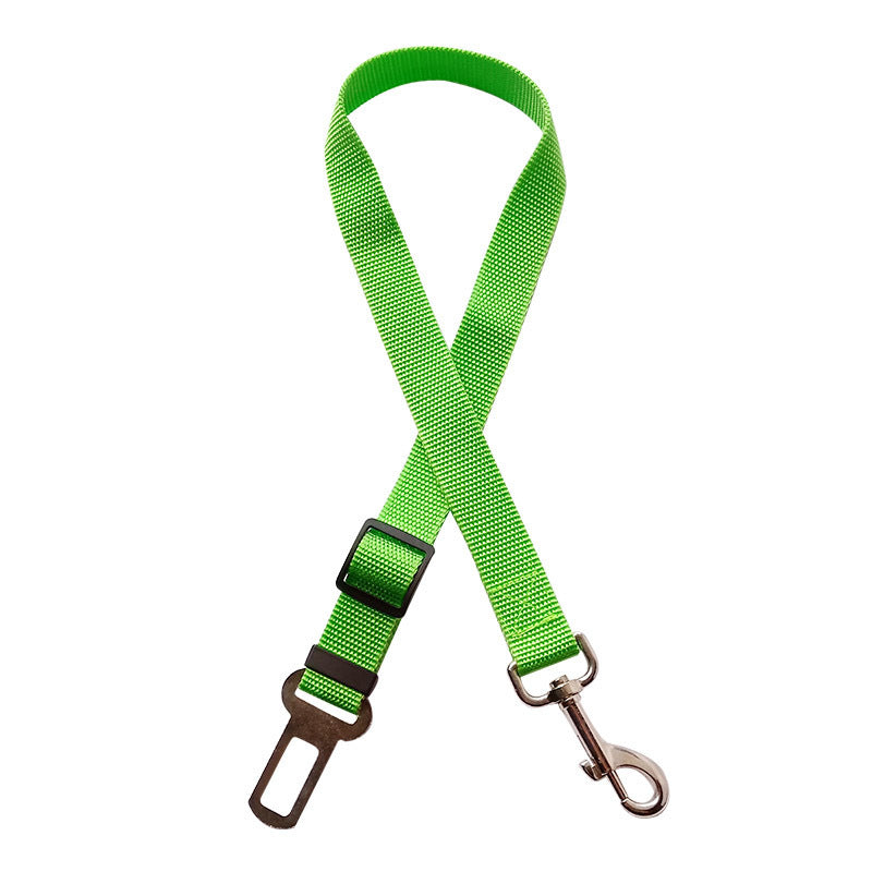 Adjustable pet car seat belt with bright green strap, metal hook, and clasp
