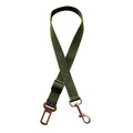 Adjustable pet car seat belt with dark green strap, metal hook, and clasp