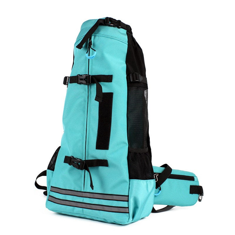Turquoise pet carrier backpack with front flap, zipper pocket, and shoulder strap